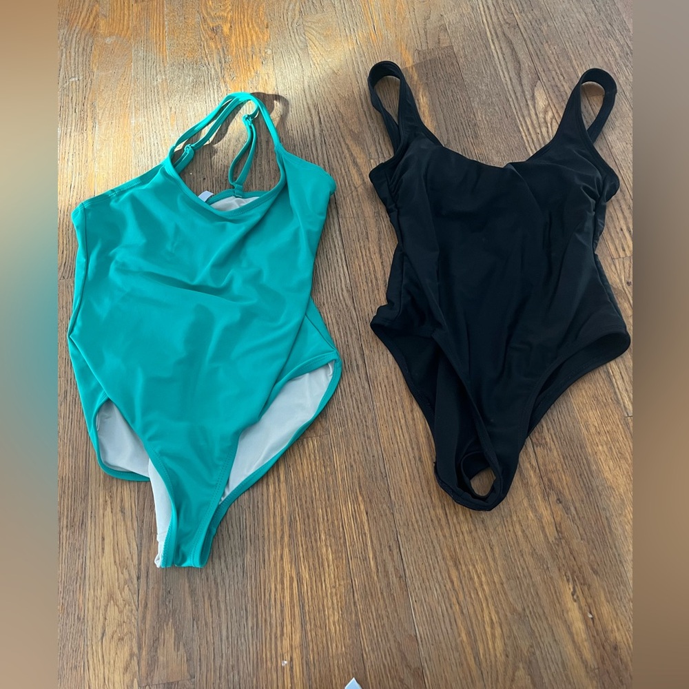 2 women’s onepiece swimsuits, green and black